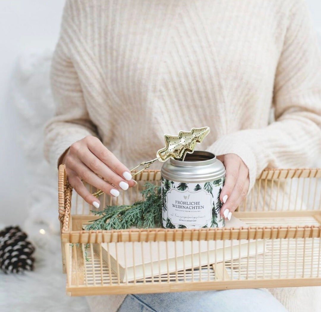Goudkleurige theetang voor de kerst thee Merry Christmas