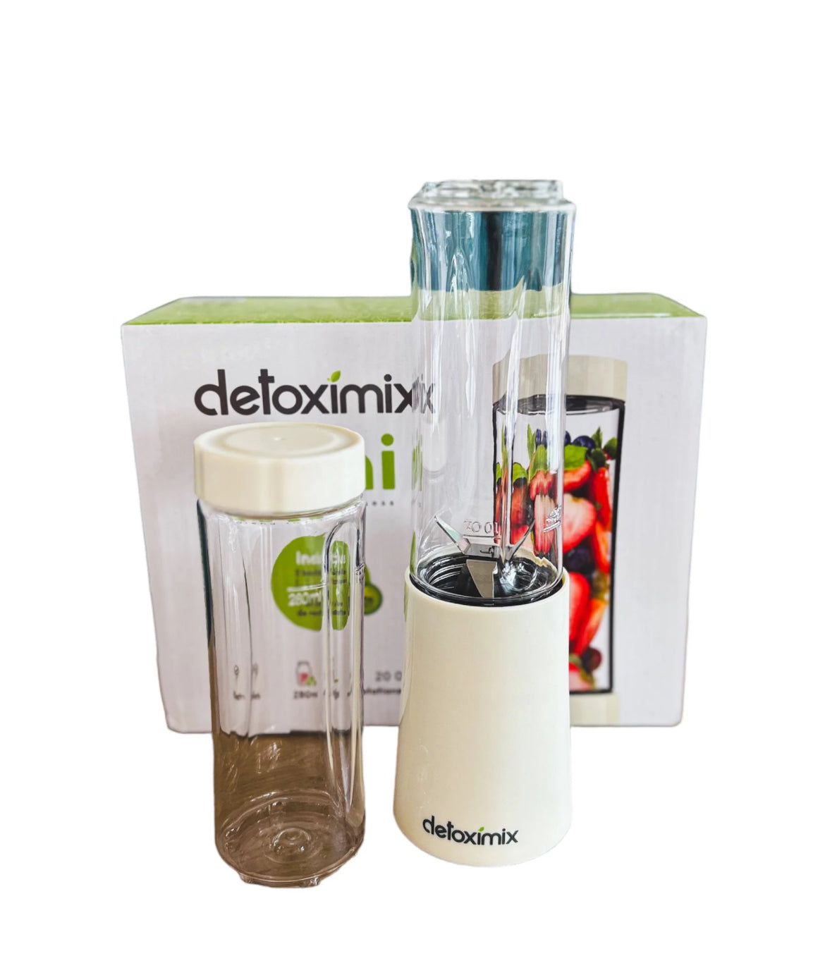 "Detoximix mini gebroken witte blender met twee transportflessen en receptenboek, ideaal voor gezonde smoothies onderweg."