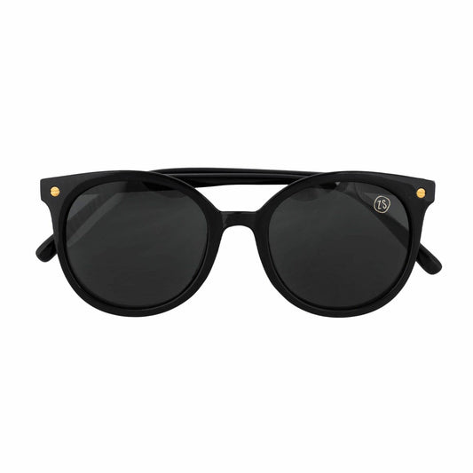 Zusss stoere zonnebril met gouden elementen en ronde glazen met hoes en doekje.